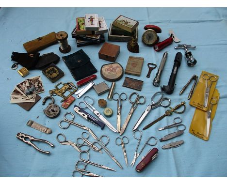 A quantity of vintage miscellaneous items to include pen knives, scissors, playing cards and corkscrews