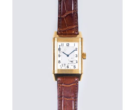   Jaeger-LeCoultre  gegr. 1833 in Vallée de Joux  Große Herren-Armbanduhr  'Reverso' in Gelbgold mit Datum und Gangreserve  1