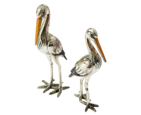 Two silver and enamel figures modelled as storks, stamped 925, 8cm high and 7cm high. (AF)