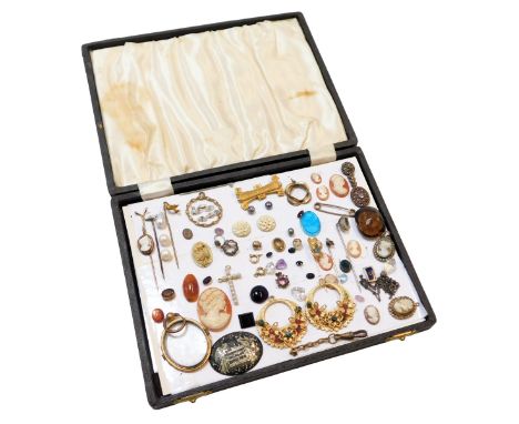 A group of 19thC and later jewellery, comprising pendant frames, loose cameos, crucifix, stick pins, etc, in a presentation b