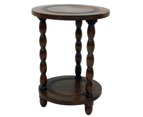 A 20thC circular two-tier occasional table, raised on bobbin turned supports, 51cm high, 38cm diameter.