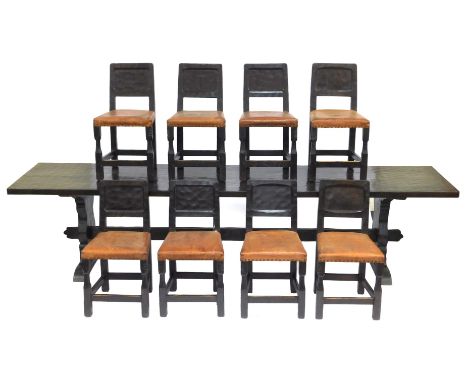 A Thomas Gnomeman Whittaker Yorkshire dark oak dining table and chairs, comprising a three plank refectory dining table, rais