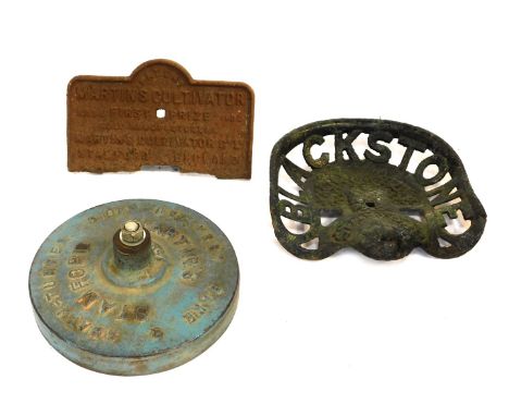 A cast iron Blackstone and Company Ltd Stamford tractor seat, 40cm wide, and a Martin Cultivator cast iron sign for First Pri