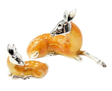  Two silver and enamel figures, modelled as a recumbent deer, stamped 925, 4.5cm high, and a fawn, 2.5cm high. 