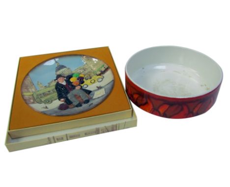 A Poole pottery Delphis bowl, printed marks, 25cm diameter (AF), together with a Royal Doulton The Balloon Man character plat