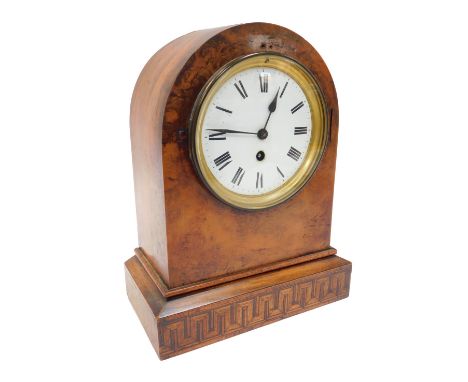 A late 19thC walnut and inlaid mantel clock, the circular white enamelled dial bearing Roman numerals, thirty hour movement, 