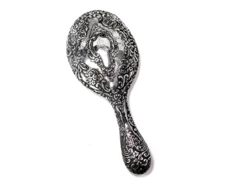A silver backed dressing table mirror, pierced floral design bearing the initials A R.