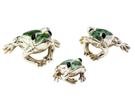 A set of three graduated silver and enamel figures modelled as frogs, each stamped 925, 3cm high, 2.3cm high and 2cm high. 