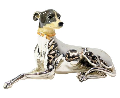 A silver and enamel figure modelled as a seated Greyhound, stamped Italy 925, 9cm high. 