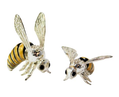 Two silver and enamel figures modelled as bees, stamped Italy 925, 3.5cm high and 1.5cm high. 