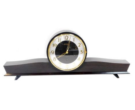 A Seiko mahogany cased mantel clock, the circular dial bearing silvered chapter ring with Roman numerals, seven jewel movemen