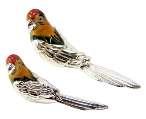 Two silver and enamel figures modelled as macaws, each stamped 925, 3cm high and 2.5cm high. 