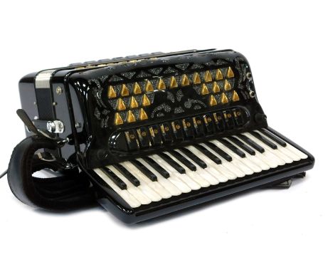 A Brandoni Super Musette piano accordion, in canvas case.
