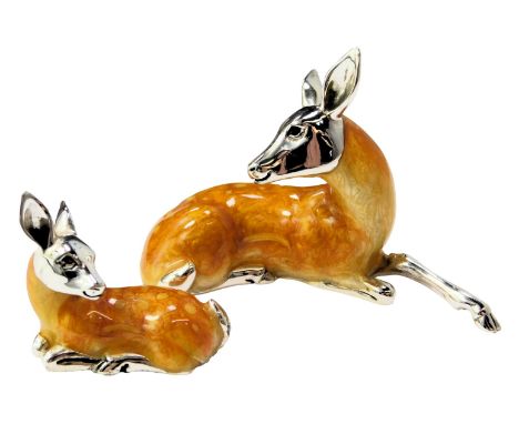  Two silver and enamel figures, modelled as a recumbent deer, stamped 925, 4.5cm high, and a fawn, 2.5cm high. 