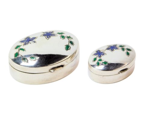 An Elizabeth II silver pill box, of oval form, with floral enamel decoration to top, London 1993, 4cm wide, together with a m