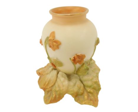A Royal Worcester blush ivory porcelain vase, of cylindrical tapering form, of raised flower and leave decoration on a leaf m