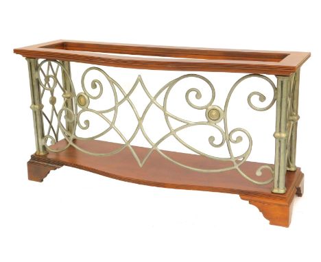 An American dark walnut and cast and wrought metal console table, with pierced front and sides on bracket feet, lacking glass