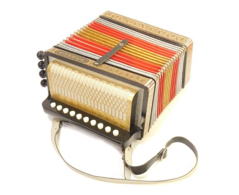 A M Hohner accordion, with leather strap, in hard case.