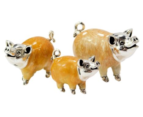  Three silver and enamel figures modelled as pigs, each stamped 925, 3.3cm high, 2.8cm high and 2cm high. 