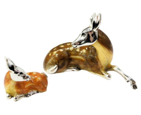 Two silver and enamel figures, modelled as a seated deer, stamped 925, 5cm high, and a fawn, 2.5cm high. 