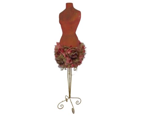 A mannequin, raised on a brass rod base, 173cm high. 