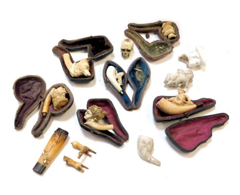 A group of 19thC and later pipes, to include carved handled dog pipe, lions, horses, etc. (mainly AF)