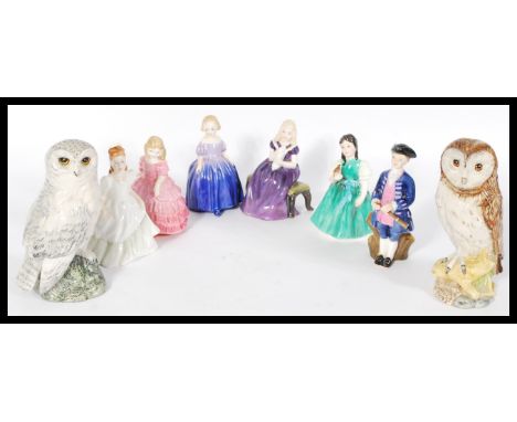 A group of seven Royal Doulton ceramic figures to include HN2183, HN1368, HN1370, HN3036, HN2236, HN2422 a Whyte and Mackay S