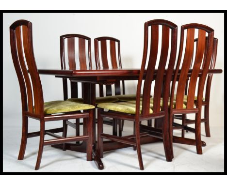 A vintage 20th century retro divine Danish dining suite with a Skovby sideboard with a curved form top, three drawers and two