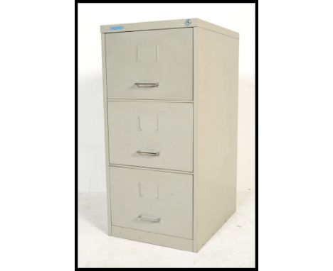 A vintage retro industrial 20th Century metal three drawer filing cabinet, chrome handles to front with name holders. Measure