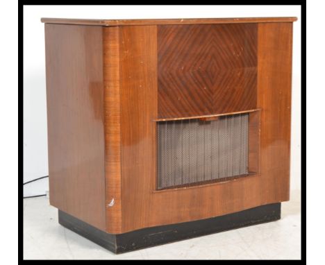 A vintage Art Deco walnut cased radiogram, fitted with a later Garrard record deck and valve radio, hinged top.