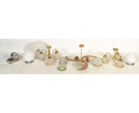 A collection of vintage lighting and fixtures to include a retro teak boomerang ceiling light, glass shades, enamel pendant s