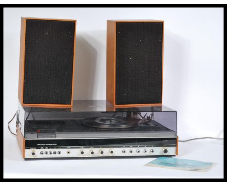 A vintage 1970's Fidelity Studio 6 teak cased and smoked perspex housing, consisting radio, tape and record playing equipment