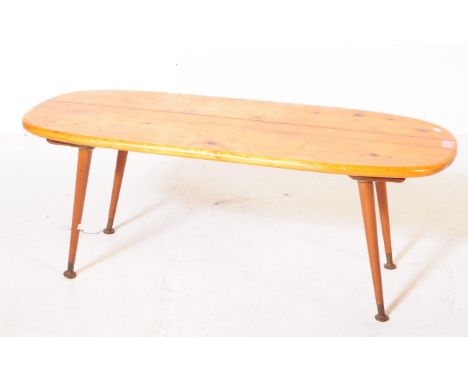 British Modern Design - A vintage 20th century pine occasional / coffee table. Curved rectangular form with tapering circular