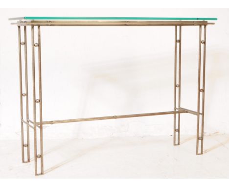 A 20th century Italian manner metal and glass console hall table. The table featuring a metal frame, with decorative roundels