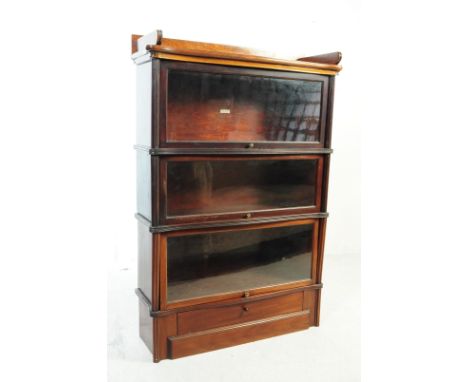 A 1920s oak three-tier sectioned lawyers barristers bookcase / library stacking cabinet in the manner of Globe&nbsp;Wernicke.