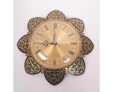 Metamec - A 20th Century vintage Metamec wall clock having brass circular face with gilt decorated flower petals to surround.