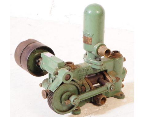 Lister - A mid 20th century small proportioned Lister stationary engine / pump. The painted in in a green colourway. Measures