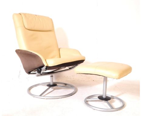 Ikea - A vintage 20th century circa 1970s easy swivel armchair. Having a rectangular back rest with cushioned headrest, curve