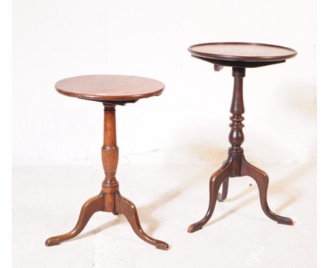 A pair of 19th century George III mahogany and oak pedestal wine tables. Each having circular tops over turned shaft over tri