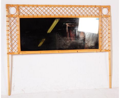A vintage circa 1970s bamboo double headboard. The headboard having bamboo trellis type frame with central mirror back. Measu