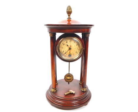 A 19th century Victorian portico clock, being of stained walnut with acorn finial to top, white floral face and Arabic chapte