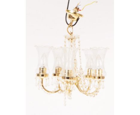 An Italian made glass and brass five arm chandelier with central glass column in a spun design, with decorative drop down gla