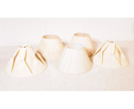 A collection of five 20th century cream silk lamp light shades. The shade all being of Pembroke empire form with ruched silk 