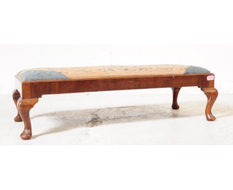 An early 20th century Edwardian mahogany two seater piano / foot stool. The stool raised on short cabriole legs, with a needl