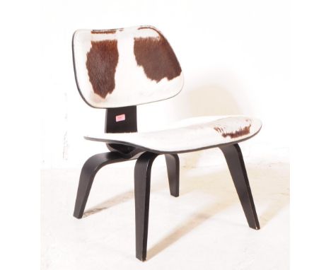 Vitra Eames - A vintage Vitra Eames plywood and calf skin chair. The chair having back and seat upholstered in calf skin with