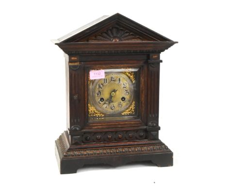 Junghans, Germany - An early 20th century oak cased 8-day movement mantel clock. The clock having&nbsp;architectural case wit