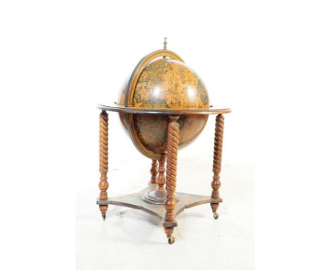 A 20th Century vintage mahogany veneer zodiac globe cocktail drinks cabinet / trolley. Having a hinged lid to globe top, open