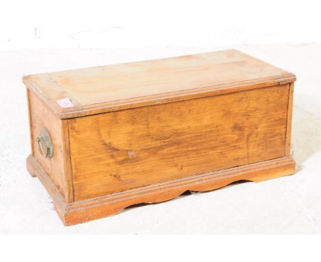 A 19th century pine wood small proportioned chest / coffer. The chest raised on block bracket feet, having brass swing handle