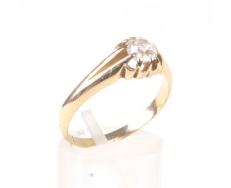 An early 20th century gold and diamond solitaire ring. The cushion-shaped old-cut stone approx. 0.52cts, claw set between tap