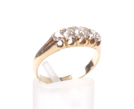 An early 20th century gold and diamond five stone ring. The five graduated old-mine and old-cut stones approx. 0.70cts total,